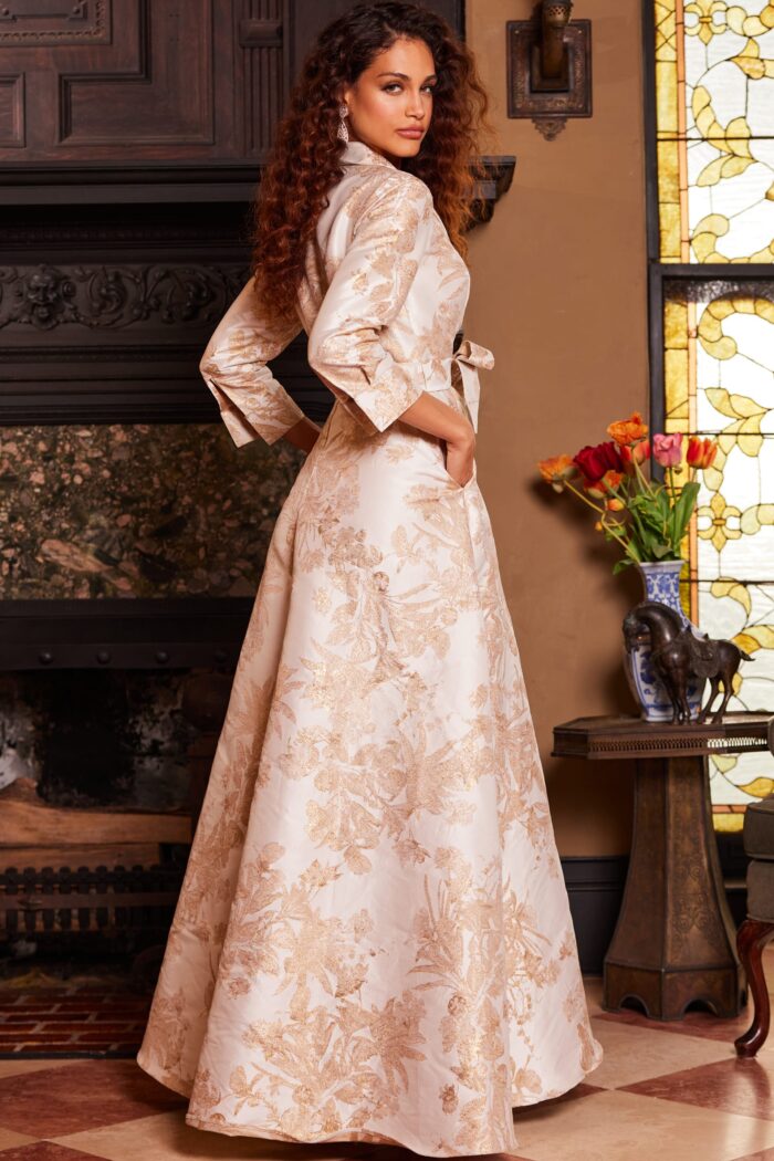 Model wearing Jovani 23178 Gold Long Sleeve V Neck Evening Gown