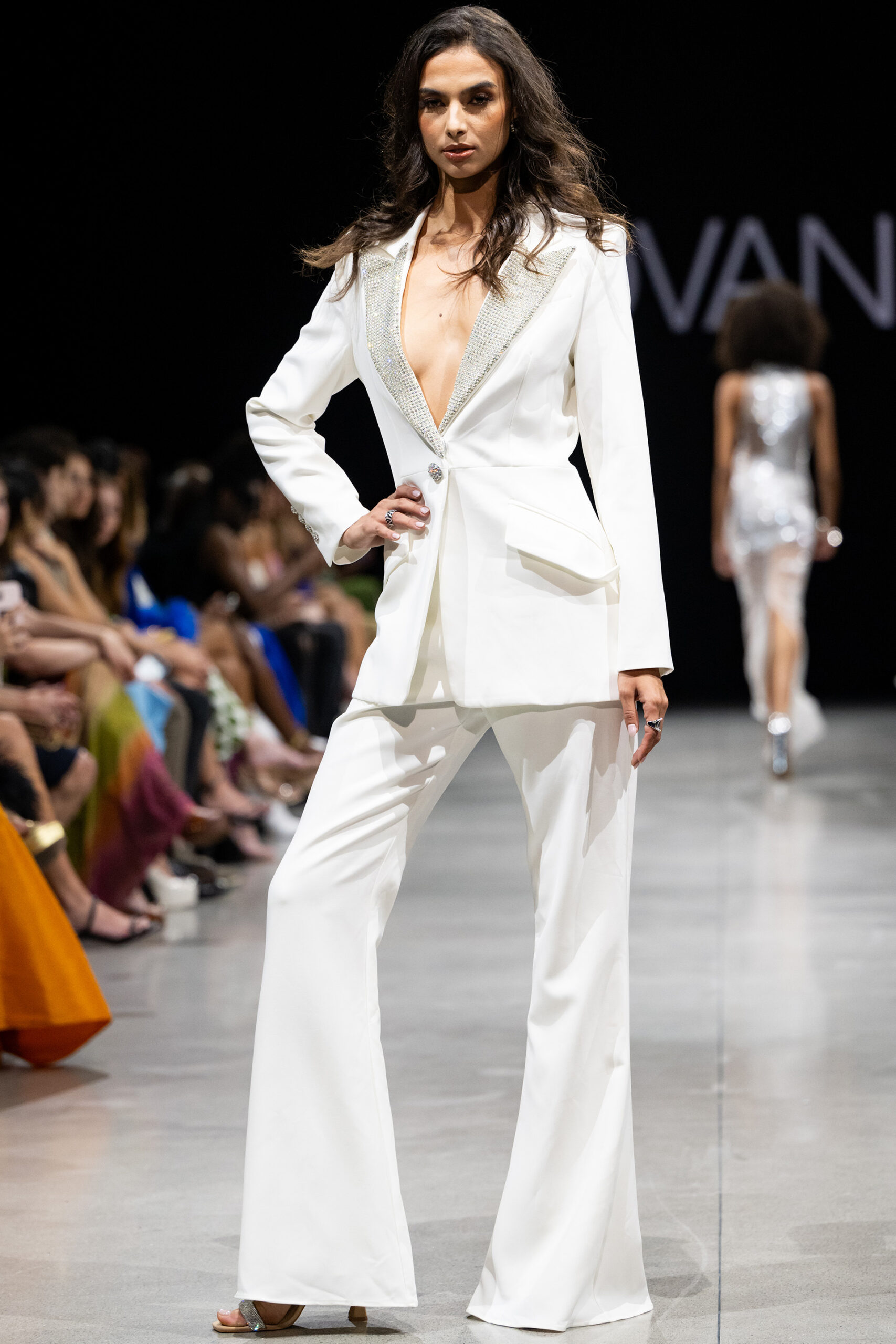 Model wearing Beaded V Neckline Off White Two Piece Suit Style 23336