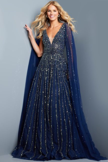 Model wearing Jovani 23362 navy dress with sequins and cape sleeve, front view.