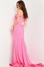 Model showcasing Jovani 23366 pink gown with off-the-shoulder design, back view