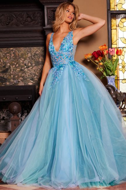 Model wearing Jovani 23577 blue gown showcasing side profile.