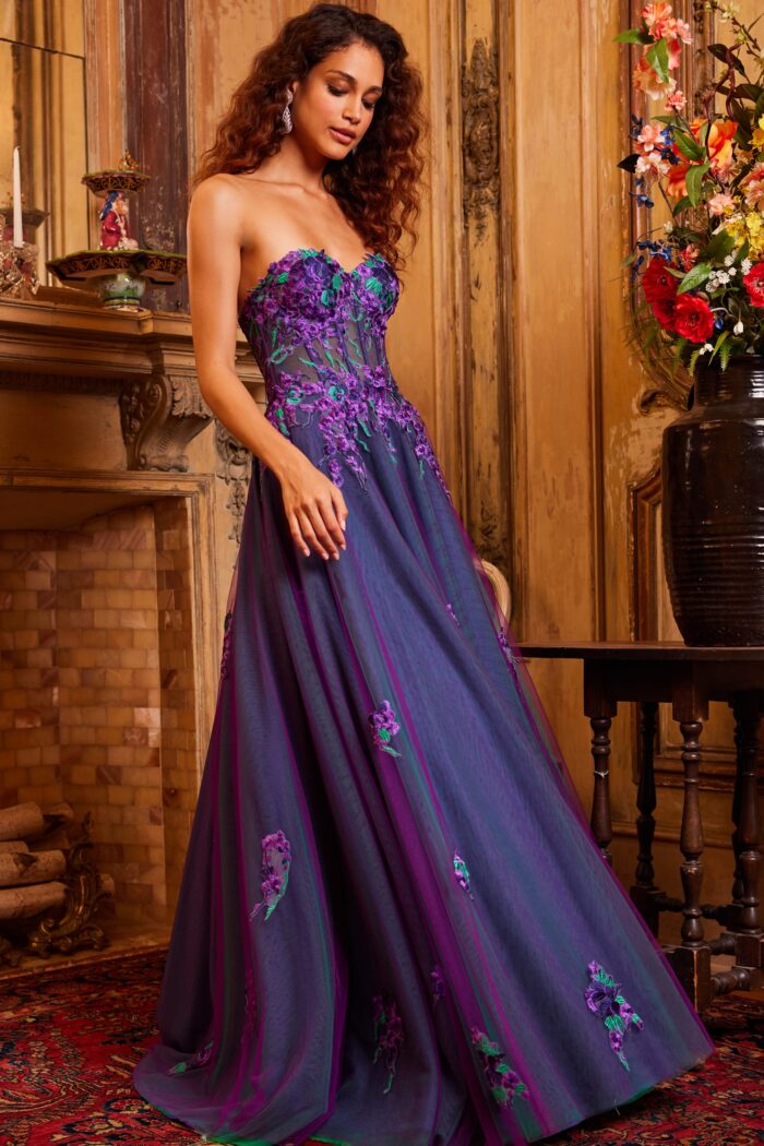 Model wearing Jovani 23578 Purple Multi Strapless Embroidered Gown