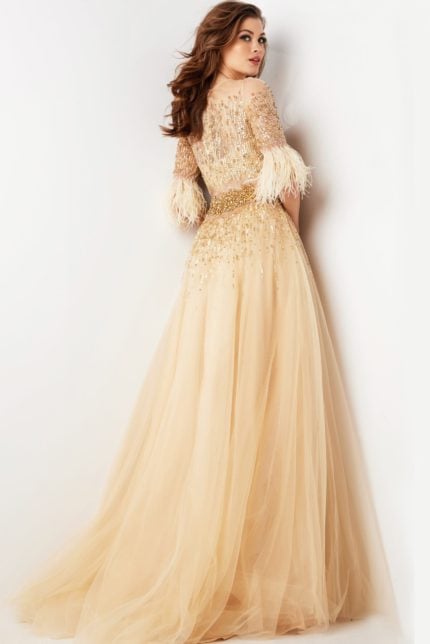 Back view of model in Jovani 23629 beige gown highlighting the flowing skirt.