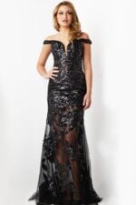 Model wearing Jovani 23834 black gown with floral applique and sheer overlay