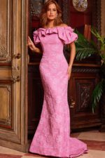 Model wearing Jovani 23847 pink gown with ruffled neckline and mermaid silhouette