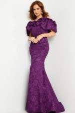 Model in Jovani 23847 purple gown, mermaid style with ruffles