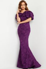 Model showcasing Jovani 23847 purple gown with floral texture