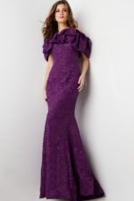 Model showcasing Jovani 23847 gown in purple with ruffled off-shoulder