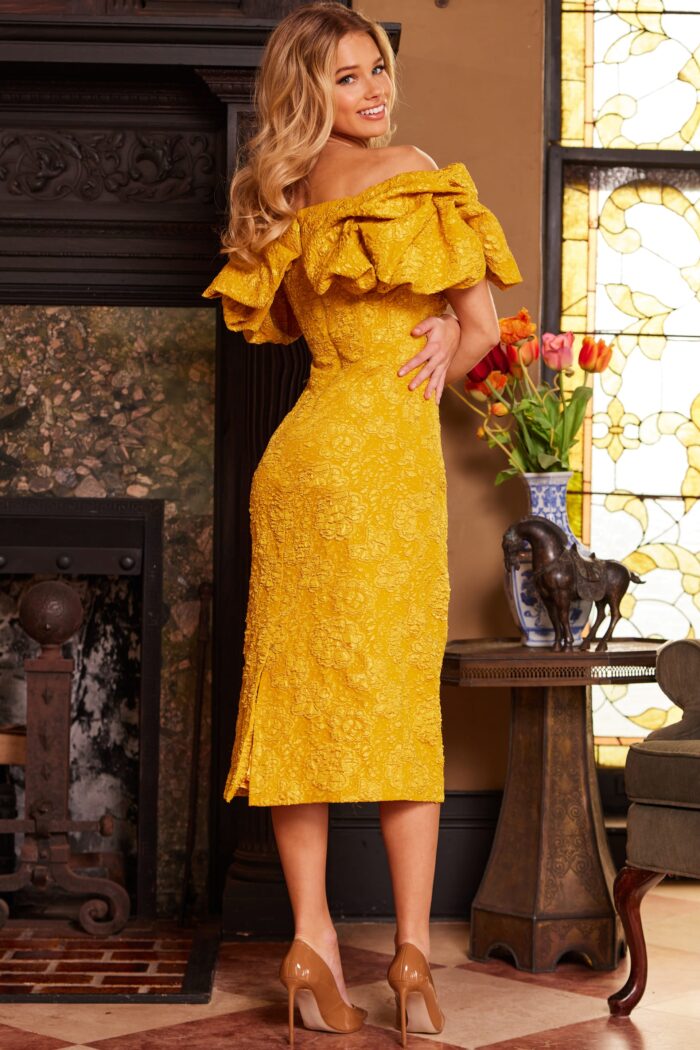 Model wearing Jovani 23848 Mustard Off the Shoulder Ruffle Neckline Dress