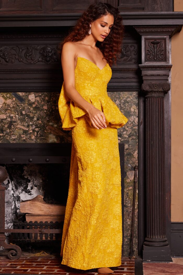 Model wearing Jovani 23849 Mustard Strapless Peplum Dress