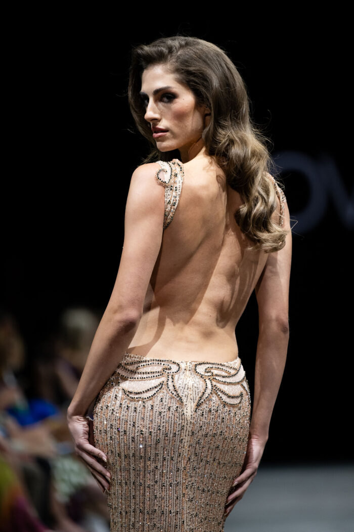 Model wearing Jovani 23896 Blush Backless Couture Dress