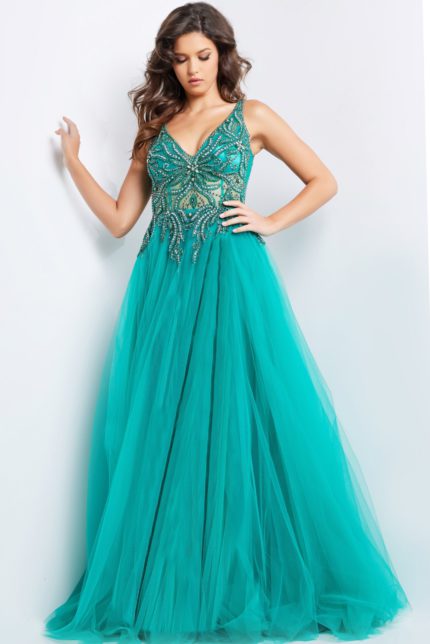 Model wearing Jovani 23962 emerald gown, front view highlighting the full-length tulle skirt.