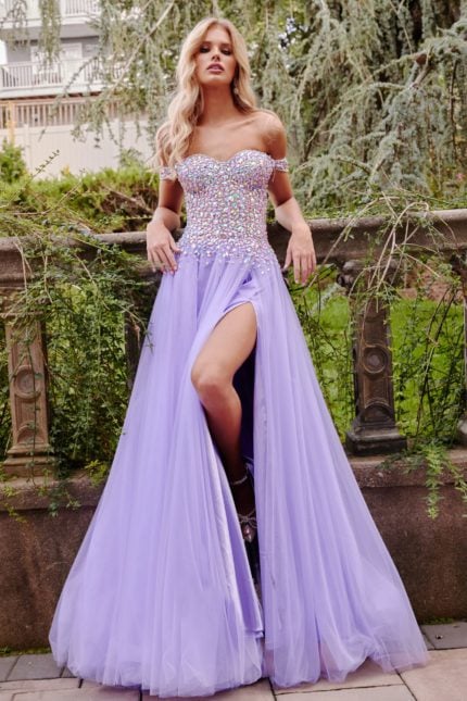 Model wearing Jovani 23963 lilac gown with embellishments, off-the-shoulder neckline, and high slit