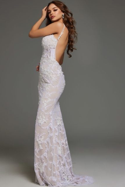 model showcasing the back of Jovani 23965 white mermaid gown with low back design