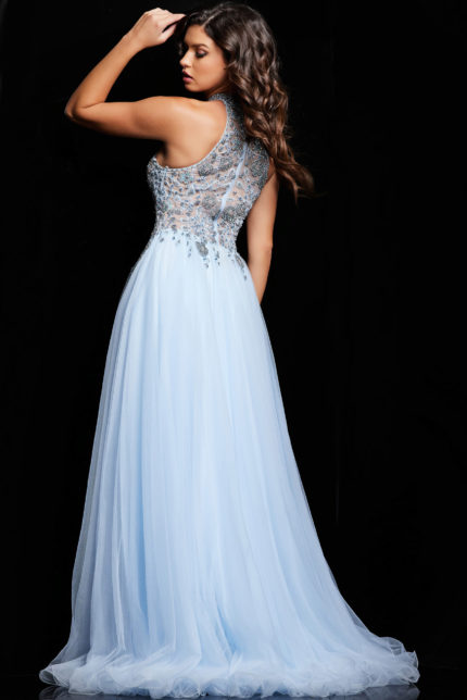 Model showcasing the back of Jovani 24094 light blue gown with embellishments.