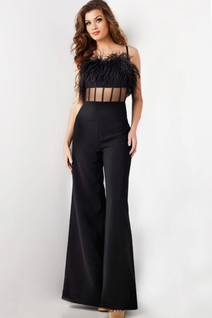 Model wearing Jovani 24144 black jumpsuit with feathered bodice and wide-leg pants, front view.