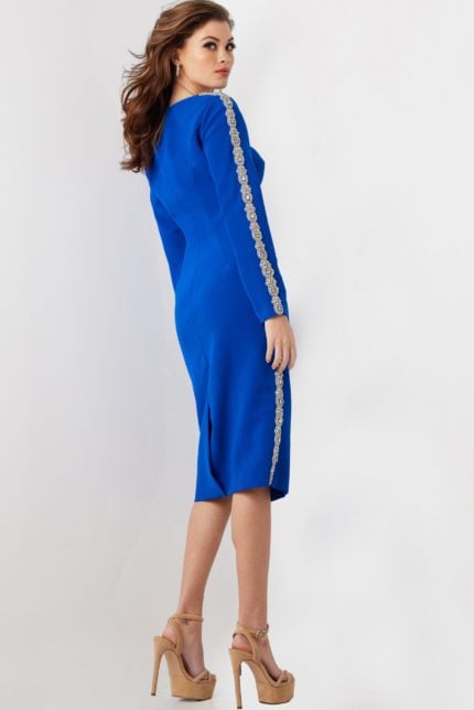 Model showcasing back view of Jovani 24192 royal blue dress with embellishments.