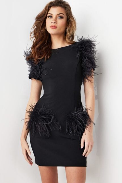 Model wearing Jovani 24558 black dress with feathered embellishments.