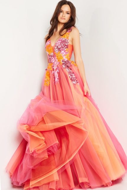 Model showcasing the front of Jovani 25800 orange gown with floral appliqués and flowing skirt.