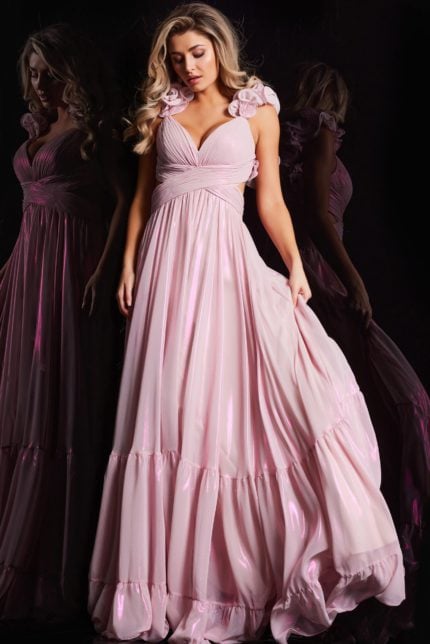 Model wearing Jovani 26248 pink gown, front view with flowing skirt.