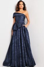 Model in Jovani 26281 navy dress with detailed pattern and elegant silhouette.