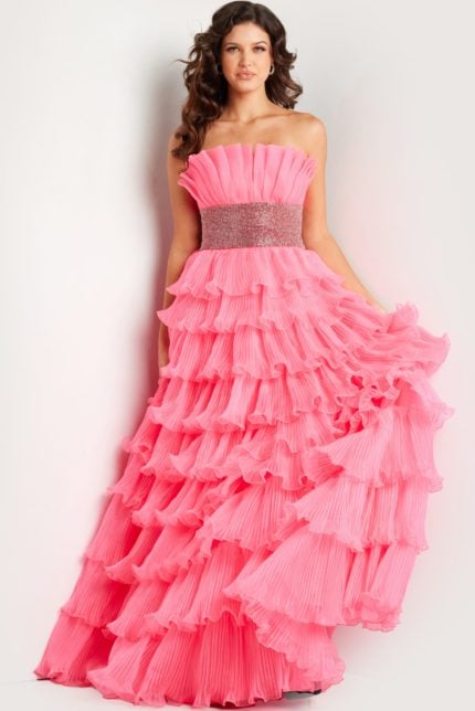 Model wearing Jovani 26314 pink gown with tiered ruffles, front view.