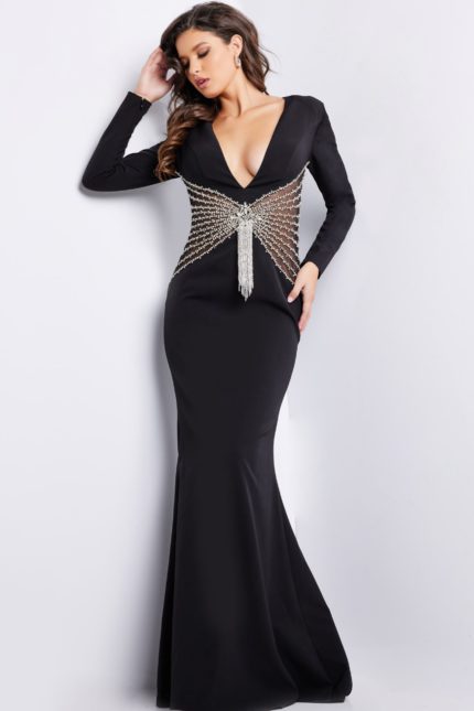 Model wearing Jovani 26317 black gown with V-neckline and beadwork from the front.