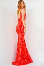 Back view of model wearing Jovani 3263 red mermaid dress with sequined pattern