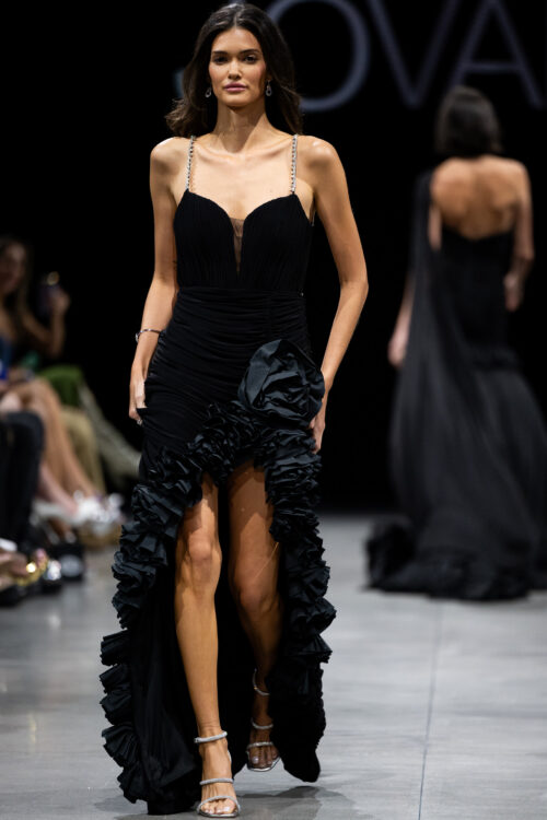 Model wearing Black High Slit Dress with Rosette Details 34392