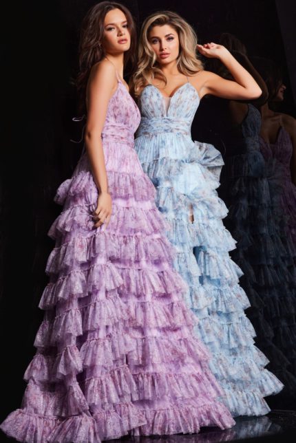 Models wearing Jovani 36571 lilac and blue full-length dresses with plunging necklines.