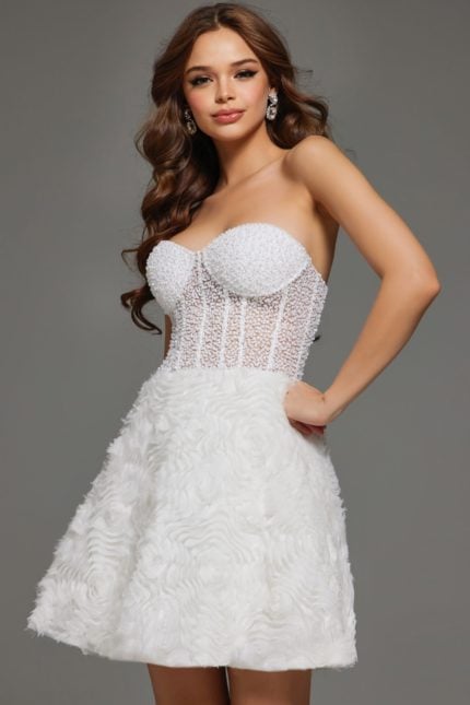 Model wearing Jovani 36578 white dress with strapless bodice and floral skirt detailing.