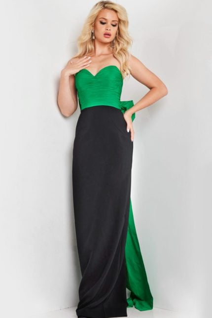 Model wearing Jovani 36670 elegant green and black gown with sweetheart neckline and bow.