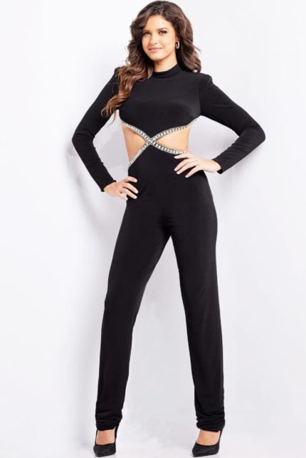 Model wearing Jovani 37038 black jumpsuit with long sleeves and cutout detailing.