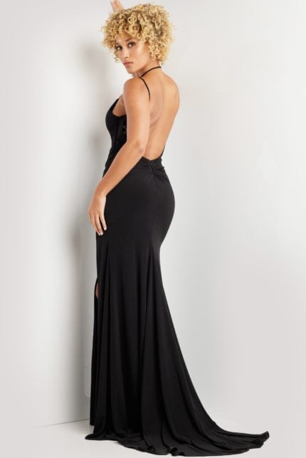 model wearing Jovani 37086 black dress showcasing open back design