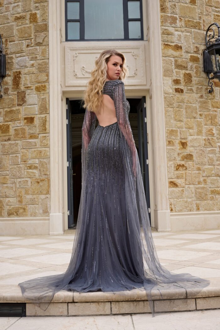 Model wearing Glamorous Gunmetal Beaded Gown with Sheer Cape and High Slit 37194