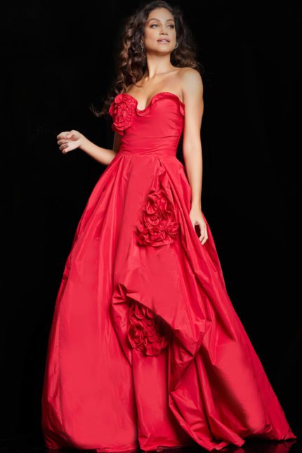 Model showcasing Jovani 37266 in red with a sweeping A-line skirt and rosette details.