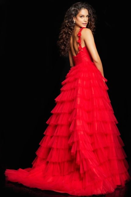 Model wearing Jovani 37274 red gown, back view showing layered tulle skirt.