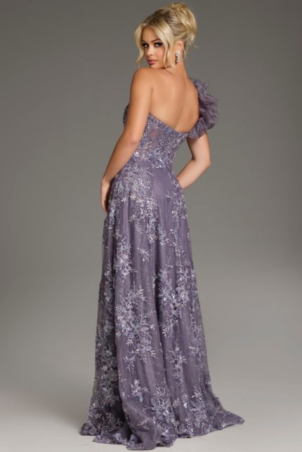 Model wearing Jovani 37353 navy gown, front view highlighting the floral embellishments and high slit.