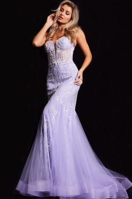 Model in Jovani 37414 lilac mermaid gown with intricate lace details, full length front view.