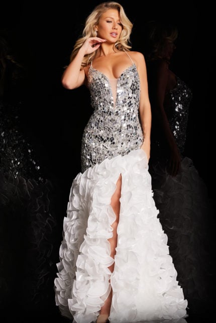 Model wearing full-length Jovani 37588 gown with V-neckline and ruffled high slit.