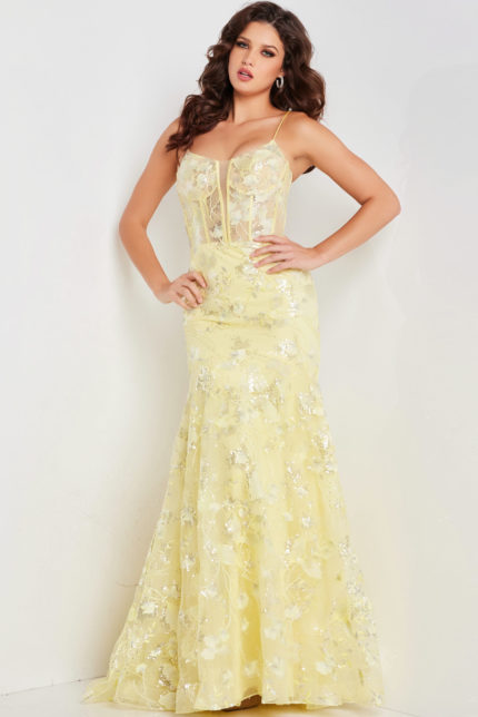 Model wearing Jovani 38004 yellow dress with floral detailing, front view.