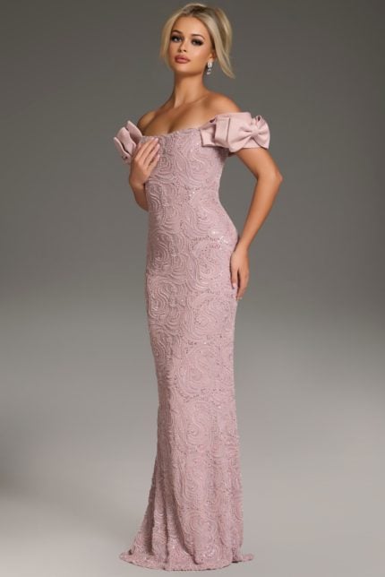 Model wearing Jovani 38112 blush mermaid gown with ruffled sleeves, side view.