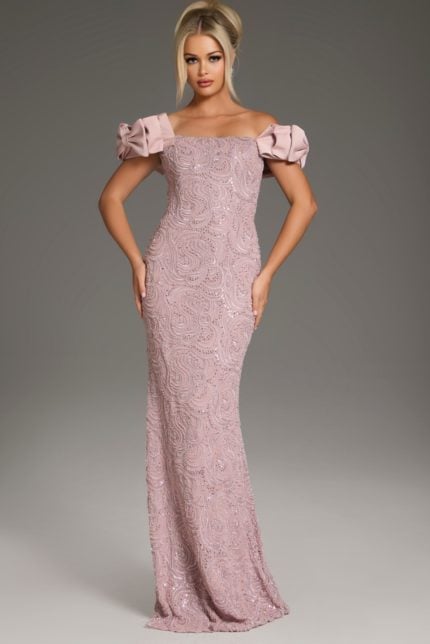 Model wearing Jovani 38112 blush mermaid gown with off-shoulder ruffled sleeves, front view.