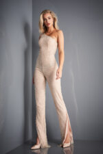 Model wearing Jovani 3816 nude jumpsuit with elegantly embellished bodice