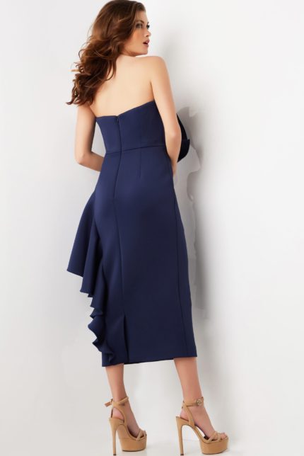 Model wearing Jovani 38187 navy dress, back view, highlighting sleek design and elegant midi length.