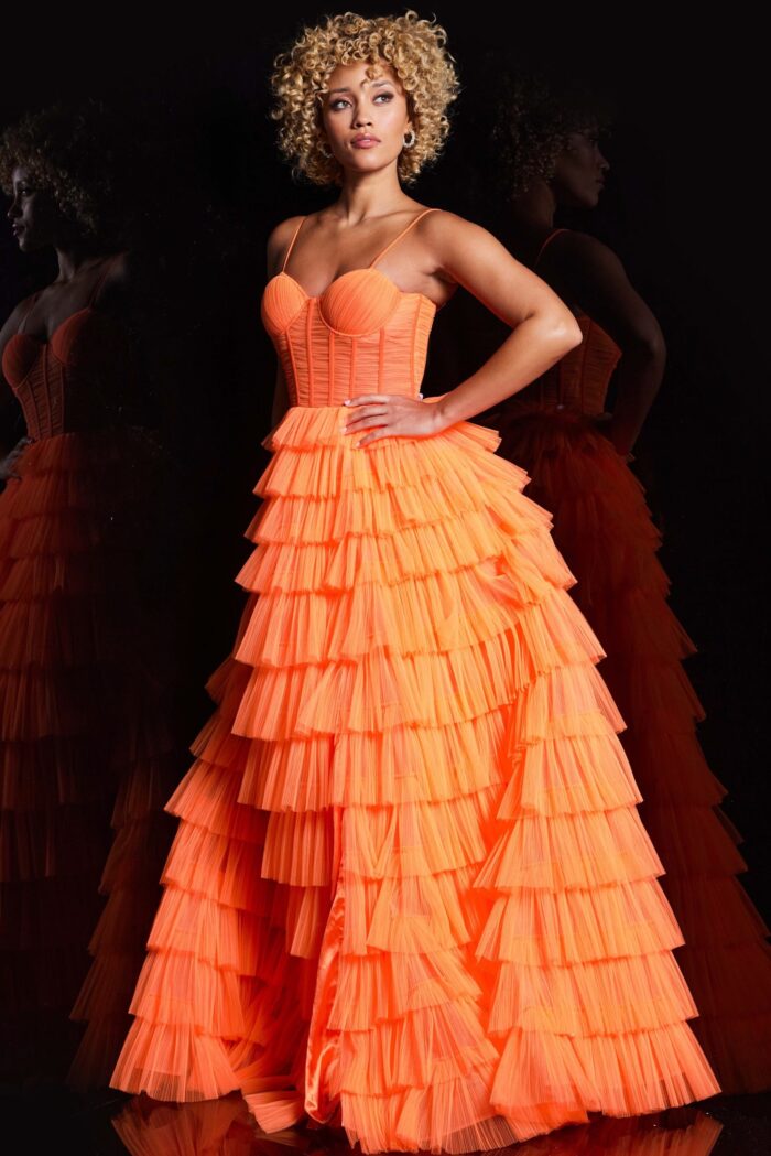 Model wearing Jovani 38277 Orange Tulle Layered Skirt Gown