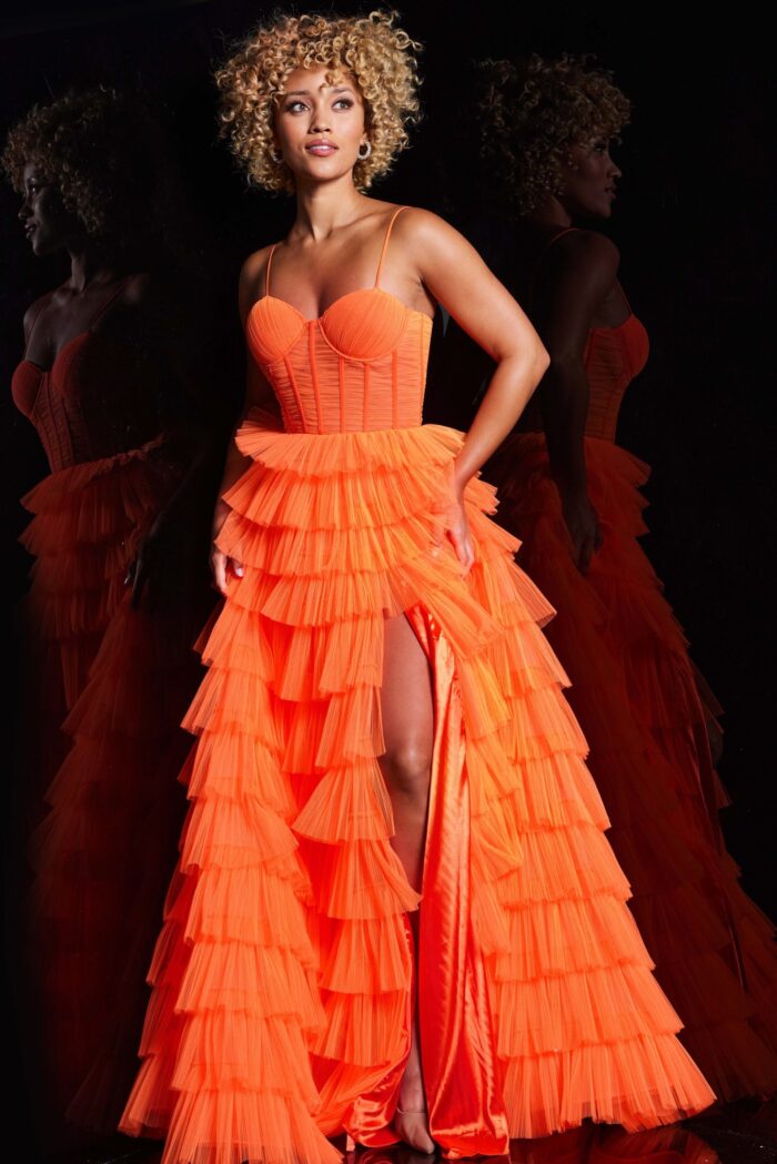 Model wearing Jovani 38277 Orange Tulle Layered Skirt Gown