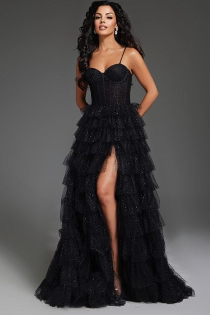 Model wearing Jovani 38278 black evening gown with high slit and sweetheart neckline.