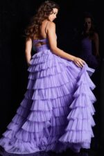 Model wearing Jovani 38290 lilac dress showing ruffled back, back view