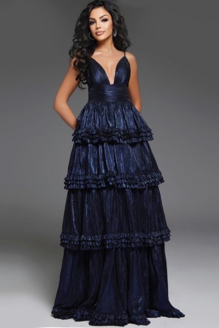 model wearing 38296 navy gown with V-neckline and layered ruffles, angled front view